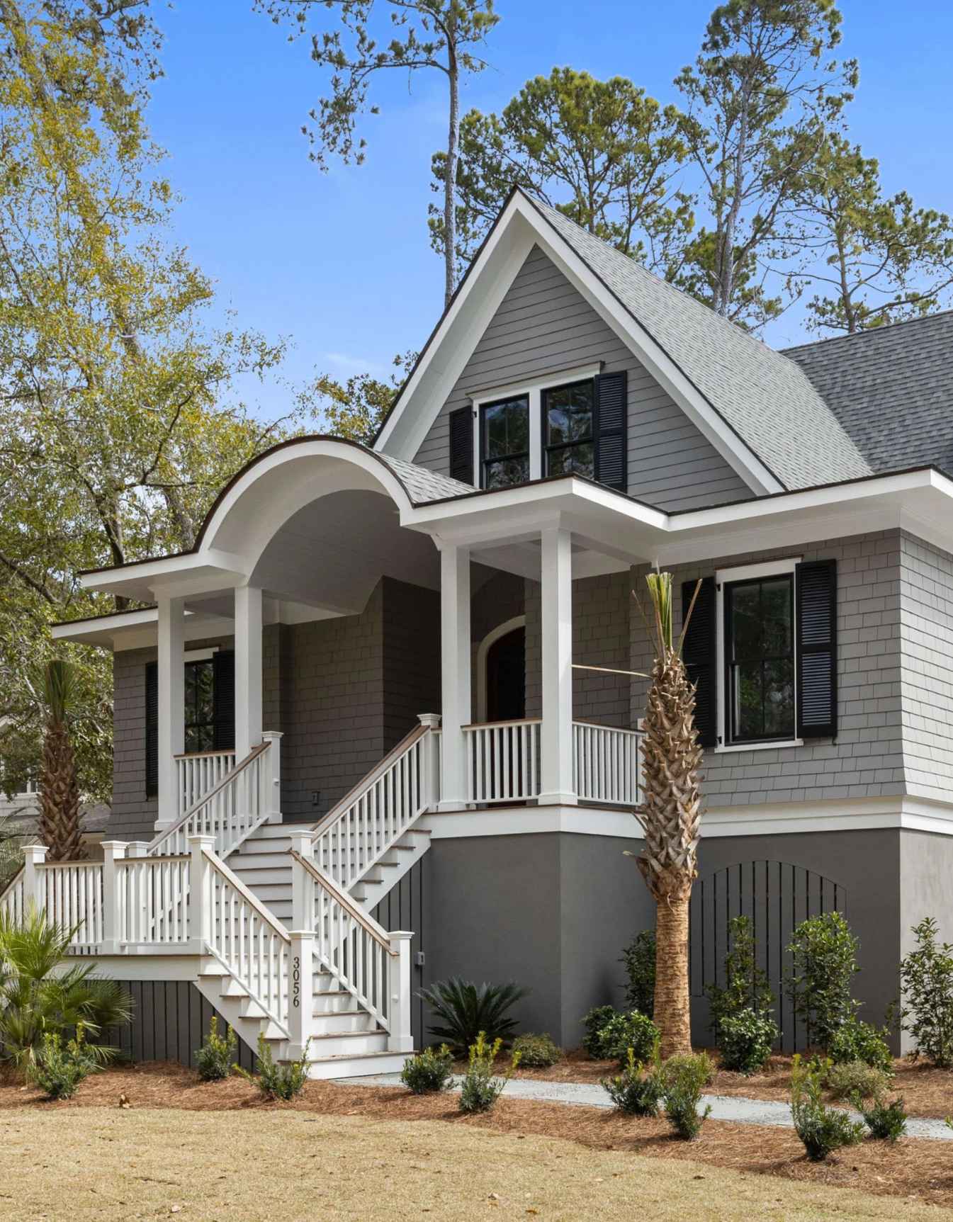 Early morning mist over a calm salt marsh on Seabrook Island with luxury homes visible in the background.