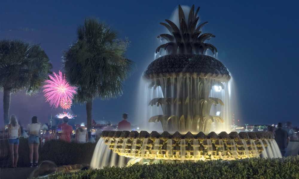 Historic Pineapple Fountain illuminated at night at Waterfront Park in Downtown Charleston SC
